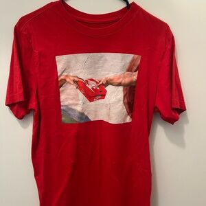 Nike Red Graphic Tee with Artistic Design
